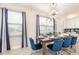 Elegant dining room featuring a modern chandelier and seating for six at 421 Southfield St, Kissimmee, FL 34747