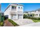 Charming two-story home featuring a two-car garage, balcony and a meticulously paved driveway at 421 Southfield St, Kissimmee, FL 34747