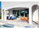 The outdoor patio features modern patio furniture, a dining table, and an outdoor ceiling fan to keep you cool at 421 Southfield St, Kissimmee, FL 34747