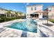 Backyard pool with a spa and an umbrella with outdoor seating makes it perfect for relaxation at 421 Southfield St, Kissimmee, FL 34747