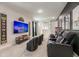 Home theater room with reclining seats, large screen television, and themed decor at 421 Southfield St, Kissimmee, FL 34747