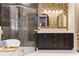 Elegant bathroom featuring a double vanity, a modern shower, and stylish wallpaper for a luxurious feel at 4310 Ethan Lane Ln, Orlando, FL 32814