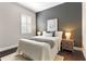 Comfortable bedroom with a plush bed, natural light, and a calm, inviting ambiance at 4310 Ethan Lane Ln, Orlando, FL 32814