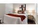 Bedroom featuring a plush bed, decorative accents, and bedside tables with lamps at 4310 Ethan Lane Ln, Orlando, FL 32814