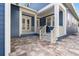 Inviting front porch with comfortable seating, elegant columns, and a charming entrance to a beautifully designed home at 4310 Ethan Lane Ln, Orlando, FL 32814