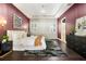 Luxurious main bedroom featuring tray ceilings, modern chandelier, and dark wood floors at 4310 Ethan Lane Ln, Orlando, FL 32814