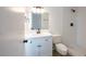 Modern bathroom with white vanity, updated fixtures, and a tiled walk-in shower at 4800 Reginald Rd, Orlando, FL 32829