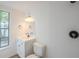 Clean bathroom with updated vanity, lighting, and tiled shower, enhanced by a bright window at 4800 Reginald Rd, Orlando, FL 32829