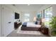 Well-lit bedroom with modern decor, a large window and a closet at 4800 Reginald Rd, Orlando, FL 32829