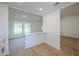 Bright dining area with light walls and wood flooring, complemented by windows for natural light at 4800 Reginald Rd, Orlando, FL 32829