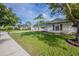 A pleasant home with a lovely lawn and landscaping enhancing curb appeal at 4800 Reginald Rd, Orlando, FL 32829