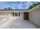 Single-story home with neutral siding, dark trim and a two-car garage at 4800 Reginald Rd, Orlando, FL 32829