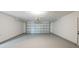 Clean, bright garage with painted floor and modern door, ready for parking and storage at 4800 Reginald Rd, Orlando, FL 32829