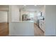 Updated kitchen featuring stainless steel appliances, white cabinetry and light wood flooring at 4800 Reginald Rd, Orlando, FL 32829