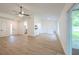 Spacious living room featuring views into the kitchen and sliding glass doors to the backyard at 4800 Reginald Rd, Orlando, FL 32829