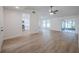 Cozy living room with vaulted ceilings, views to the updated kitchen, and sliding doors to a screened lanai at 4800 Reginald Rd, Orlando, FL 32829