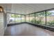Enclosed patio offering outdoor living with screened walls, ceramic tile floors, and natural lighting at 4800 Reginald Rd, Orlando, FL 32829