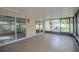 Spacious screened patio with tile floor, sliding glass doors and outdoor lighting at 4800 Reginald Rd, Orlando, FL 32829