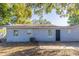 Backyard featuring the back of the house and a concrete slab at 4933 Balboa Dr, Orlando, FL 32808