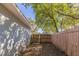 Backyard with a wooden fence and a gate to a smaller back area at 4933 Balboa Dr, Orlando, FL 32808