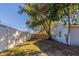 Backyard featuring a wooden fence and partial grass with trees at 4933 Balboa Dr, Orlando, FL 32808