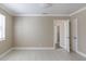 This bedroom features neutral paint, white tile flooring, and crown moulding detail throughout at 4933 Balboa Dr, Orlando, FL 32808