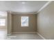 Bright bedroom with neutral paint, large window letting in natural light, and white tile flooring at 4933 Balboa Dr, Orlando, FL 32808