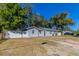 Charming single-story home with a fenced yard and mature trees providing shade at 4933 Balboa Dr, Orlando, FL 32808