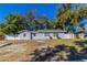 Inviting single-story home with mature trees and a well-maintained front lawn at 4933 Balboa Dr, Orlando, FL 32808