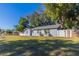 A pleasant single-story home with a cozy, fenced yard and shady trees at 4933 Balboa Dr, Orlando, FL 32808