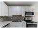 Beautiful kitchen featuring sleek stainless steel appliances and ample counter space at 4933 Balboa Dr, Orlando, FL 32808