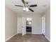 The main bedroom boasts wood-look floors, a ceiling fan, and an ensuite bathroom at 4933 Balboa Dr, Orlando, FL 32808