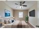 Beautifully staged main bedroom with hardwood floors, ensuite and decorations at 4933 Balboa Dr, Orlando, FL 32808