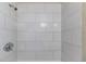 Tiled shower stall featuring white, horizontally laid rectangular tiles and chrome fixtures at 4933 Balboa Dr, Orlando, FL 32808