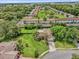 An aerial view of a home surrounded by lush greenery and neighborhood at 4959 Ardmore Dr, Winter Park, FL 32792