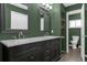 Well-lit bathroom with a double vanity, a neutral-colored decor and granite countertops at 4959 Ardmore Dr, Winter Park, FL 32792