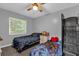 Bedroom featuring two twin beds, gray decor, hardwood floors, and large windows at 4959 Ardmore Dr, Winter Park, FL 32792