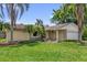 Inviting front yard with lush green grass and landscaping at 4959 Ardmore Dr, Winter Park, FL 32792