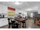 Charming kitchen with white cabinets, a breakfast bar, and stainless steel appliances at 4959 Ardmore Dr, Winter Park, FL 32792