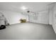 Spacious garage with a large garage door and ample room for parking and storage solutions at 584 S Andrea Cir, Haines City, FL 33844
