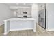 Kitchen featuring white countertops, stainless steel appliances and grey cabinets at 584 S Andrea Cir, Haines City, FL 33844