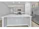 Kitchen featuring white countertops, stainless steel appliances and grey cabinets at 584 S Andrea Cir, Haines City, FL 33844