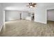 Open concept living room, dining and kitchen area with lots of natural light and wood-look tile floors at 584 S Andrea Cir, Haines City, FL 33844