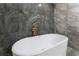 Elegant bathroom featuring a freestanding tub, gold fixtures, and stylish tile work at 6019 Crystal View Dr, Orlando, FL 32819
