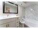 Well-lit bathroom featuring a vanity with gold fixtures, modern tiling, and a shower-tub combination at 6019 Crystal View Dr, Orlando, FL 32819