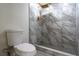 Contemporary bathroom showcasing a walk-in shower with marble-style tile and gold fixtures at 6019 Crystal View Dr, Orlando, FL 32819