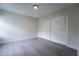 A bedroom featuring hard surface floors and a closet with folding doors at 6019 Crystal View Dr, Orlando, FL 32819