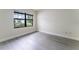 Bright bedroom with large window, sleek flooring, and fresh paint providing a serene retreat at 6019 Crystal View Dr, Orlando, FL 32819