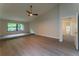 Bedroom featuring vaulted ceilings, a ceiling fan, and large windows offering ample natural light at 6019 Crystal View Dr, Orlando, FL 32819