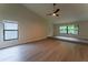 Bedroom featuring vaulted ceilings, a ceiling fan, and large windows offering ample natural light at 6019 Crystal View Dr, Orlando, FL 32819